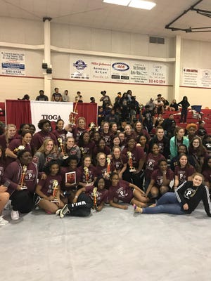 The Pineville Lady Rebels finished first at the Tioga meet Dec. 16.