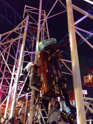 A roller coaster derailed at the Daytona Beach boardwalk in Florida on Thursday night, injuring multiple passengers and leaving a car dangling from the track.