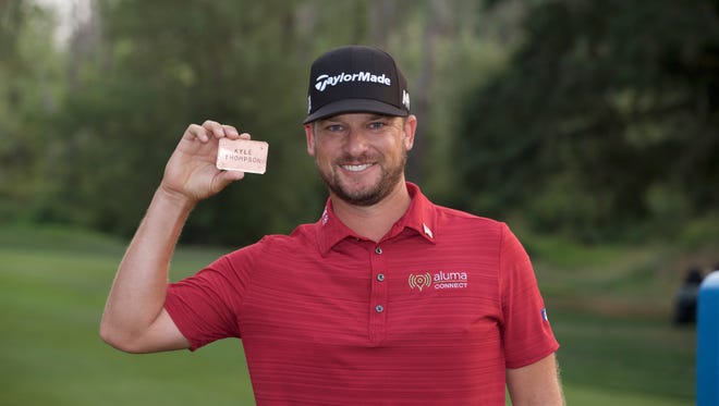 Kyle Thompson poses for a photo with his PGA Tour card after the final round of the WinCo Foods Portland Open at Pumpkin Ridge Golf Club - Witch Hollow on August 27, 2017, in North Plains, Oregon.