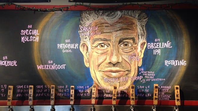 Bier Brewery's taproom and marketing manager Sarah Buschmann created a tribute to Anthony Bourdain. She creates the chalk art to display the latest beer lineup in the Indianapolis taproom.