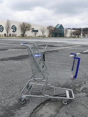 In this Tuesday, March 17, 2020, photo, a lone shopping cart sits in an empty parking lot near a shopping mall closed due to coronavirus concerns in Pottsville, Pa. In Pennsylvania last week, 12,200 people filed for unemployment insurance. In just a single day this week, that number exploded beyond 50,000. In neighboring Ohio, 48,460 people filed for unemployment Sunday and Monday, compared to less than 1,900 over the same period the week before. Itâs the same story in state after state, as millions of displaced Americans lose their jobs amid the widening shutdowns to contain the coronavirus. (Jacqueline Dormer/Republican-Herald via AP)