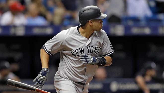 New York Yankees' Gary Sanchez drops his bat as he watches his three-run home run off Tampa Bay Rays starting pitcher Alex Cobb during the second inning of a baseball game Wednesday, Sept. 21, 2016, in St. Petersburg, Fla.