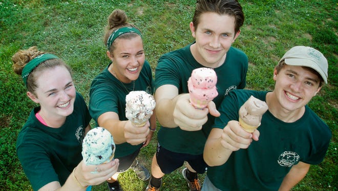 Woodside Farm Creamery employees (from left) Caitlin Barry, Alex Hitchens, Victor Pelillo and Jack Smith mix business and pleasure in advance of National Ice Cream Day on Sunday.