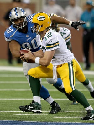 Lions defensive tackle Ndamukong Suh sacks Packers quarterback Aaron Rogers when the teams met at Ford Field on September 21, 2014 .
