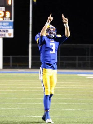 Marana quarterback Connor Leavens points to the sky.