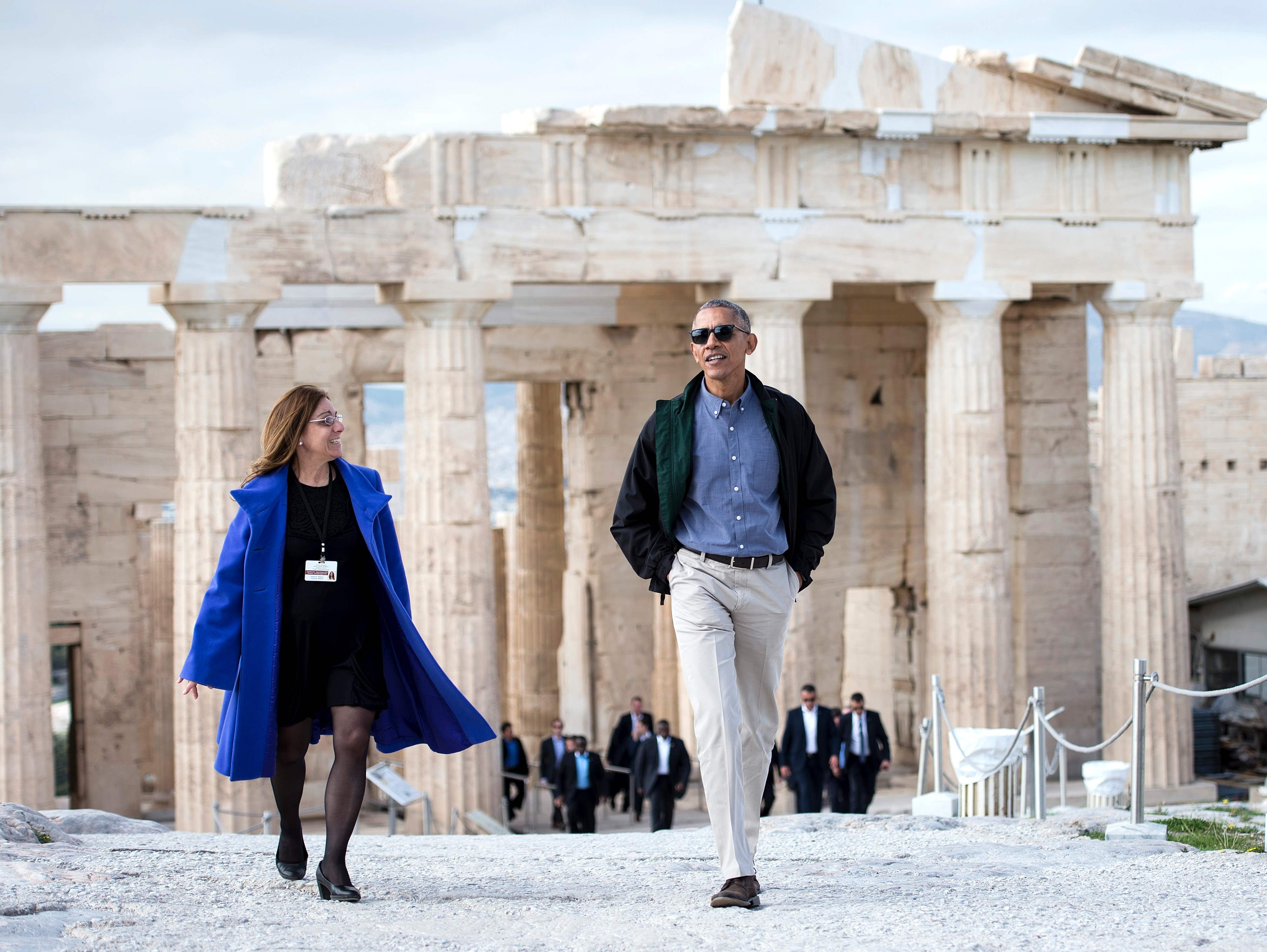 President Barack Obama walks from the Propylaia with Eleni Banou, Ministry of Culture director of Ephorate of Antiquities for Athens, during a tour of the Acropolis on Wednesday in Athens.  Obama will sketch out his vision of democracy at a time of mo