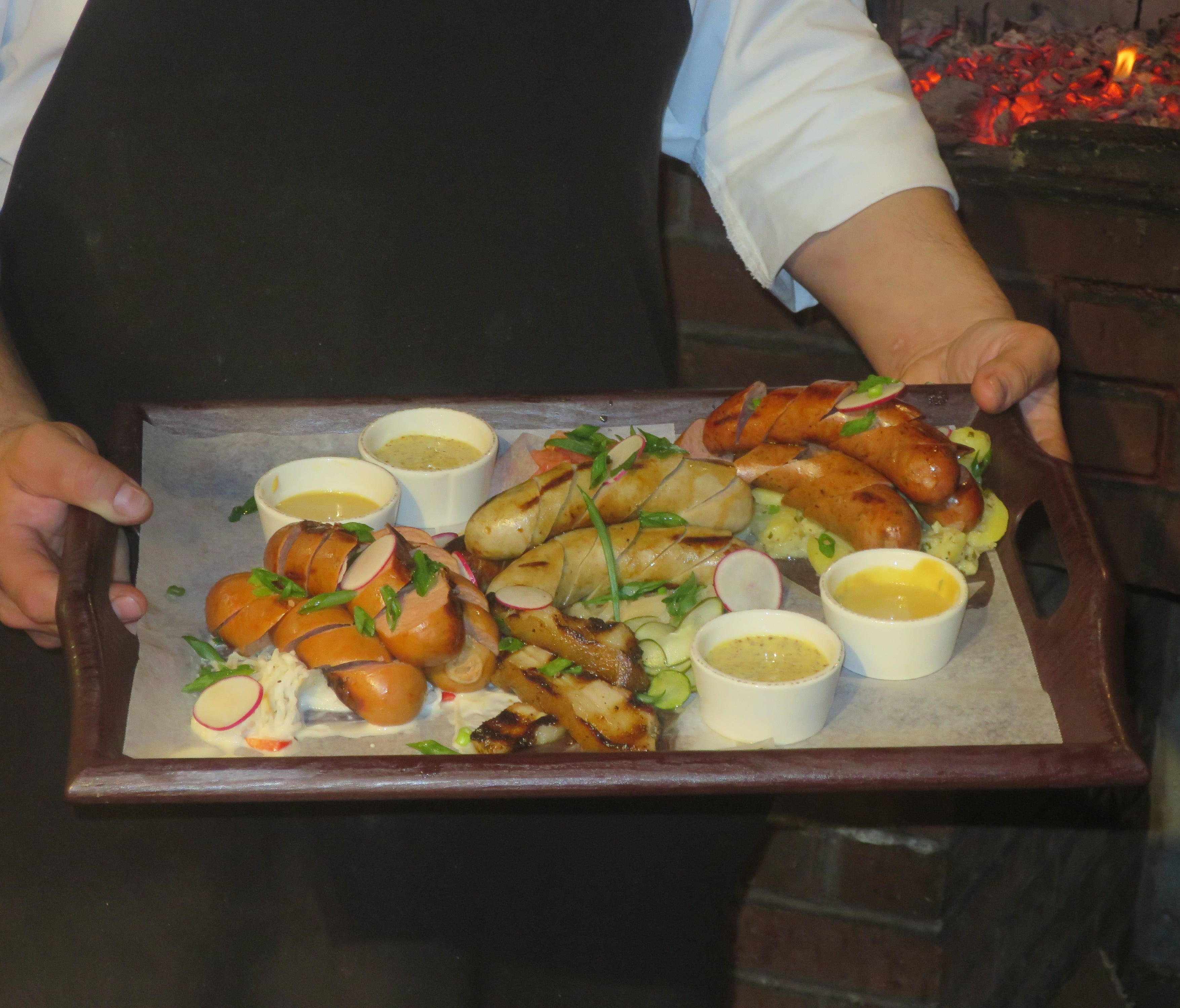 The Grilled Meat Platter is an array of wurst sausages and pork jowl.