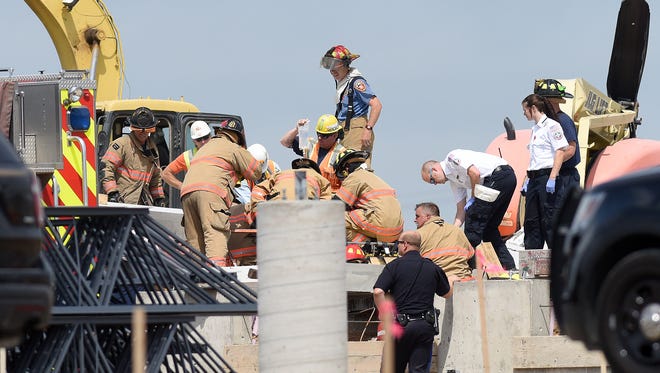 Emergency crews respond to a structure collapse near W. Madison Street and N. Ebenezer Avenue on Monday.