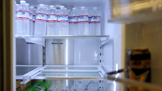 A refrigerator with bottled water is available at Willamette Valley Appliance in Keizer on Wednesday, May 30, 2018. The Keizer Chamber of Commerce asked willing businesses to open up their faucets for Salem residents in need of clean water.