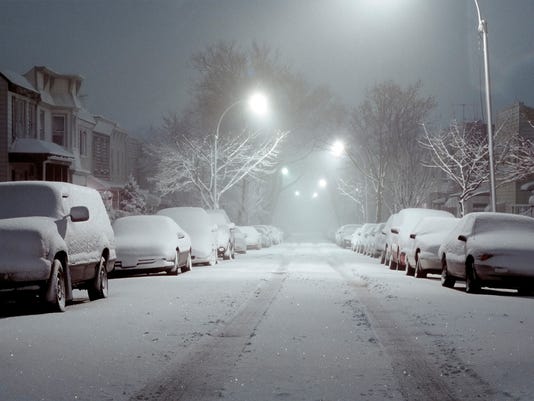 snow-covered-cars-lit-by-street-lights.jpg