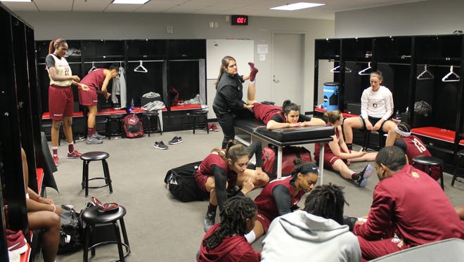 Florida State's women's basketball team relaxes in the locker room before practice in Stockton California.