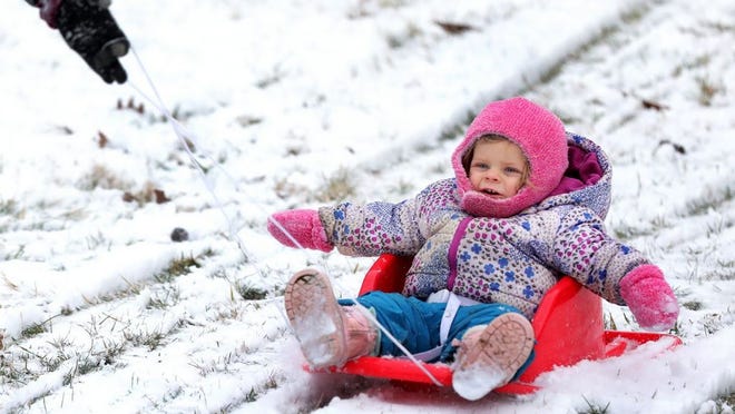 Ceana Vaughn gets a sled ride from her mother, Jillian, at Alum Creek Park North in February 2020.