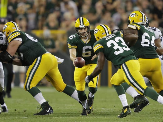 Green Bay Packers' Joe Callahan hands off the ball