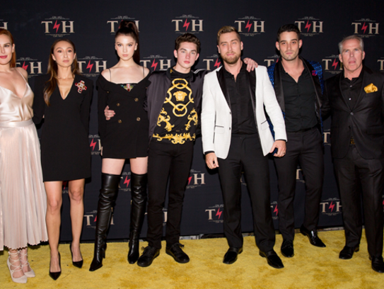 The Henry family stands with Rumer Willis, Lance Bass