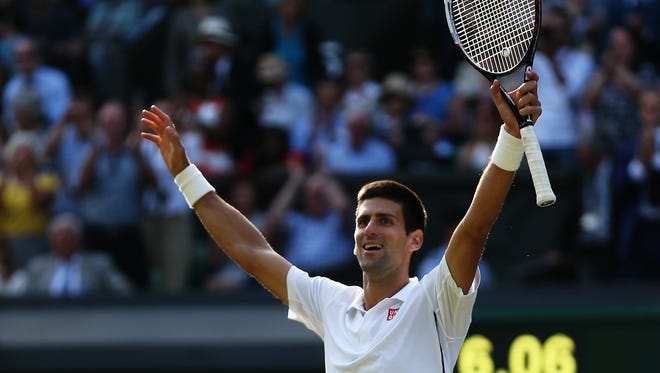 Novak Djokovic celebrates winning the Wimbledon singles final over Roger Federer on Sunday in London.