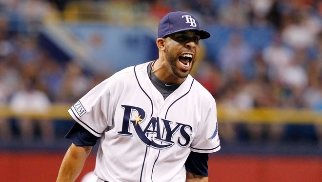 Tampa Bay pitcher David Price reacts after a strike out to end the top of the eighth inning against Boston on Friday.