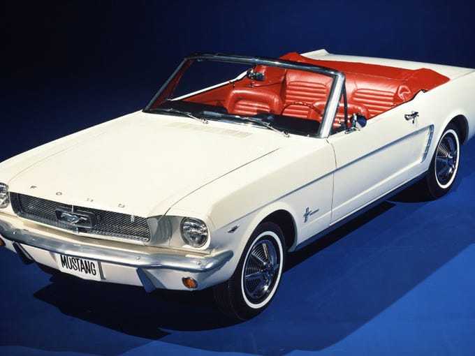 The 1964 1/2 Mustang is shown.