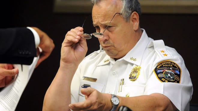 Police Chief Michael Cioffi looks at some documents as he testifies during a disciplinary hearing for Lt. Scott Mura at Englewood Cliffs Municipal Court on Wednesday, Sept. 16, 2015.