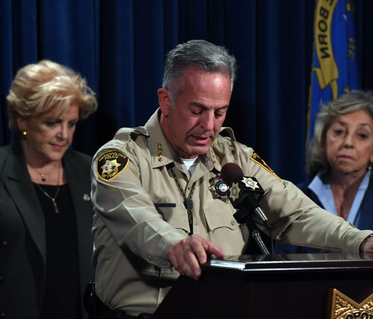Clark County Sheriff Joe Lombardo (C), flanked by Las Vegas Mayor Carolyn Goodman (L) and U.S. Rep. Dina Titus (D-NV), speaks during a news conference at the Las Vegas Metropolitan Police Department headquarters to brief members of the media on a mas