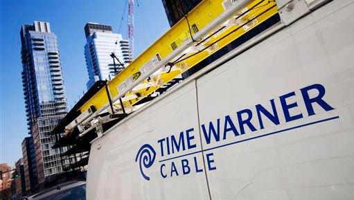 FILE - This Feb. 2, 2009 file photo shows a Time Warner Cable truck in New York .Charter Communications is close to buying Time Warner Cable for about $55 billion, two people familiar with the negotiations said Monday, May 25, 2015. (AP Photo/Mark Lennihan, File)