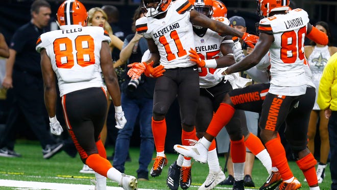 Cleveland Browns wide receiver Antonio Callaway (11) celebrates with tight end Darren Fells (88) and wide receiver Jarvis Landry (80) after scoring a touchdown during the second half of an NFL football game against the New Orleans Saints in New Orleans, Sunday, Sept. 16, 2018. (AP Photo/Butch Dill)