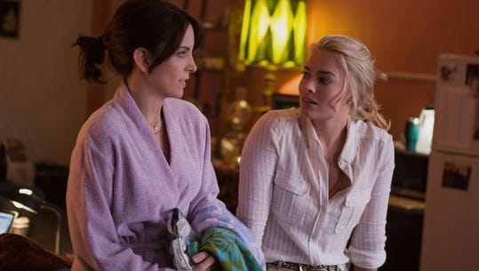 Tina Fey (left) and Margot Robbie are war correspondents Kim Baker (the writer's last name is tweaked for the movie) and Tanya Vanderpoel in 'Whiskey Tango Foxtrot.'