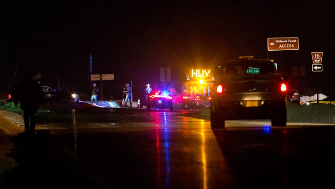 Highway 395 is blocked at Seneca between John Day and Burns, Ore., by Oregon State police officers the evening of Tuesday, Jan. 26, 2016. A more than 50-mile stretch of highway in Oregon has been closed near where an armed group has been occupying a national wildlife refuge. A group led by Ammon Bundy seized the headquarters of the Malheur National Wildlife Refuge south of Burns on Jan. 2 as part of a long-running dispute over public lands in the West.  (Dave Killen/The Oregonian via AP) MAGS OUT; TV OUT; NO LOCAL INTERNET; THE MERCURY OUT; WILLAMETTE WEEK OUT; PAMPLIN MEDIA GROUP OUT; MANDATORY CREDIT  