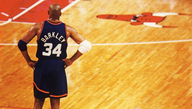 Phoenix Suns forward Charles Barkley looks on during the triple overtime win in Game 3 against the Chicago Bulls during the 1993 NBA Finals in Chicago.