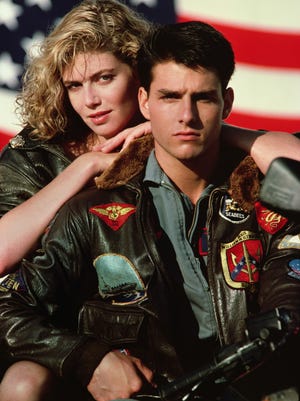 
In this film publicity image released by Paramount Pictures, Kelly McGillis, left, and Tom Cruise are shown in a promotional image for the 1986 film, "Top Gun."
