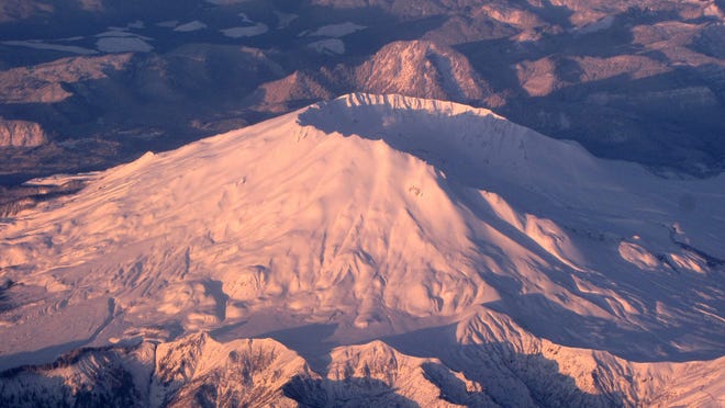The morning sunrise hits the fresh snow on Mount St. Helens in Oregon, Wash.