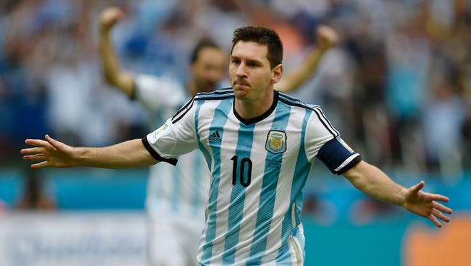Argentina's Lionel Messi celebrates after scoring his side's first goal during the group F World Cup soccer match against Nigeria at the Estadio Beira-Rio in Porto Alegre, Brazil, Wednesday, June 25, 2014.
