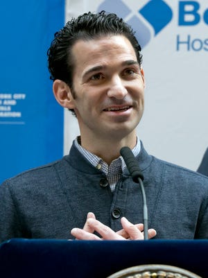 Dr. Craig Spencer, who was the first Ebola patient in New York City, speaks during a news conference at New York's Bellevue Hospital, Tuesday, Nov. 11, 2014. Spencer was released from Bellevue Hospital on Tuesday, 19 days after he was diagnosed with the virus. The physician had been working with Doctors Without Borders.