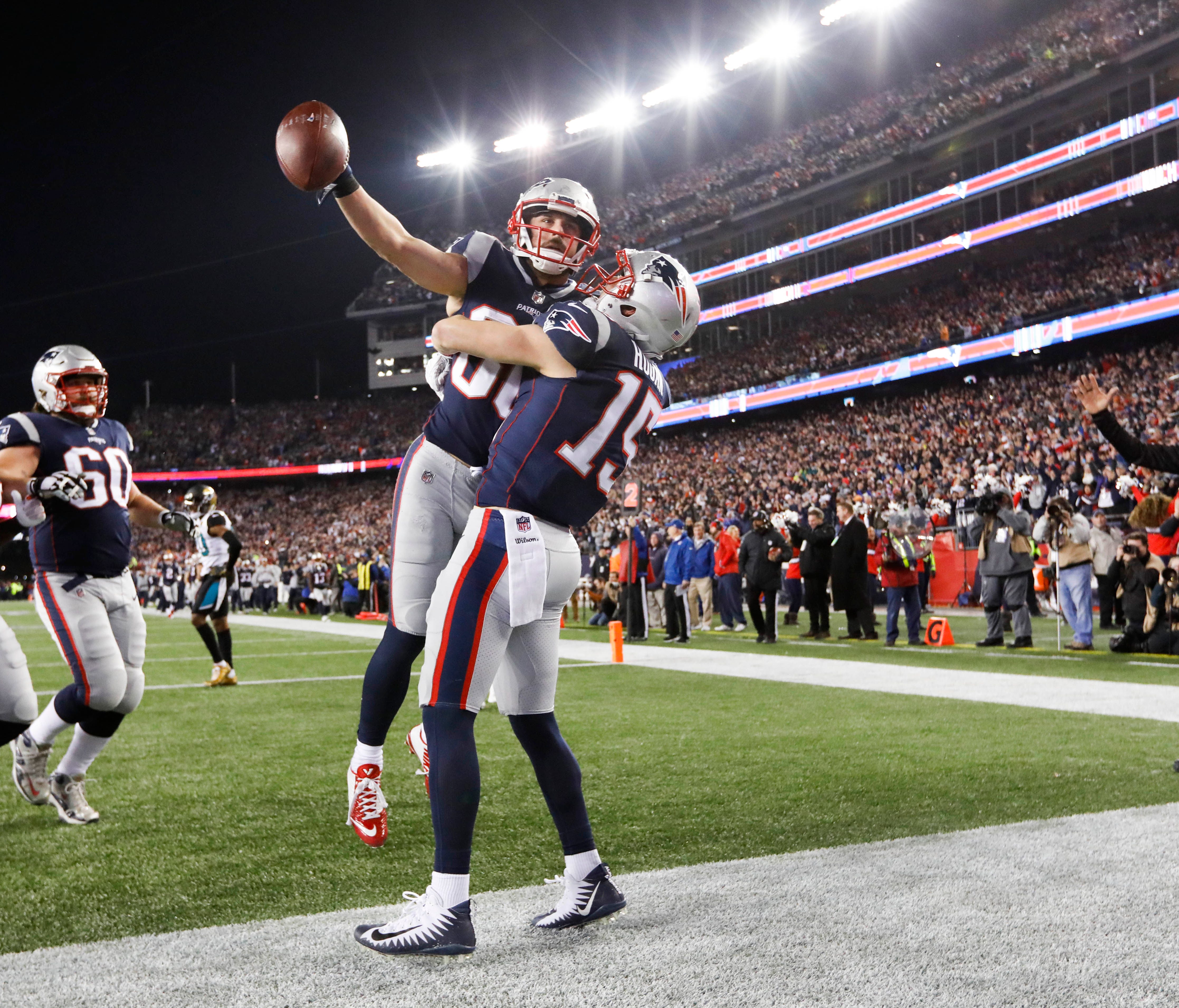 New England Patriots wide receiver Danny Amendola (80) celebrates his touchdown with wide receiver Chris Hogan (15) during the fourth quarter against the Jacksonville Jaguars in the AFC Championship Game at Gillette Stadium.