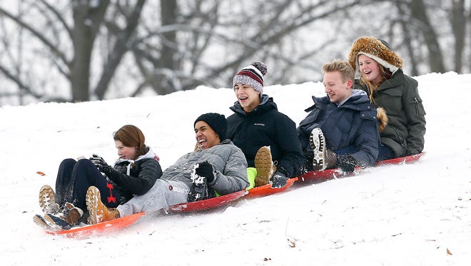 Five friends from Morristown flys down Villa Walsh Hill as children and their parents enjoy a day off from school sledding in Morristown after the area received about 4 inches of snow. January 17, 2018. Morristown, NJ.