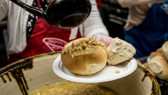 A bread bowl is filled with chili during the annual Empty Bowls fundraiser Thursday, April 21, 2016 at St. Stephen Catholic Church in Port Huron.