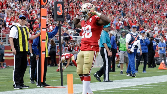 San Francisco 49ers running back Carlos Hyde (28) celebrates after running for a touchdown against the Dallas Cowboys during the first half of an NFL football game in Santa Clara, Calif., Sunday, Oct. 2, 2016. (AP Photo/Ben Margot)