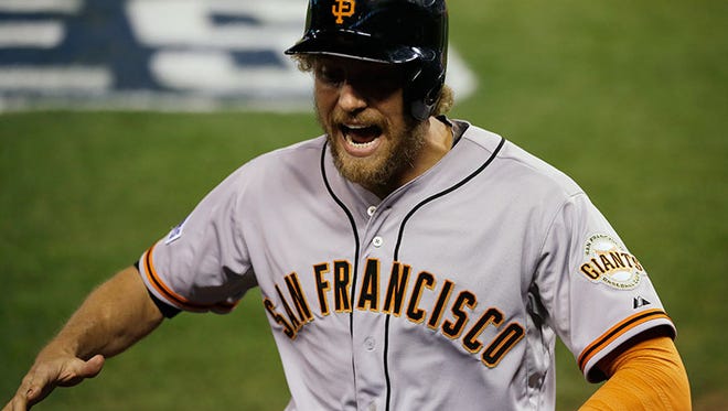 Giants rightfielder Hunter Pence celebrates after hitting a two-run home run during the first inning of Game 1 of the World Series Tuesday in Kansas City, Mo.