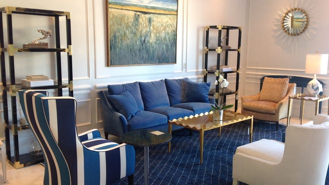 Blues from indigo to cobalt are depicted in wide stripes of blue and white and other geometric patterns. From Theodore Alexander available at Norris Home Furnishings.