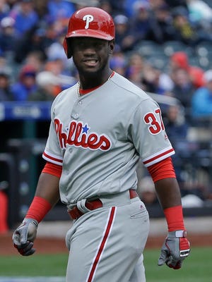 Phillies' Odubel Herrera reacts after failing to draw a walk against the New York Mets during the ninth inning Friday. Herrera is 2 for 15 to start the season.