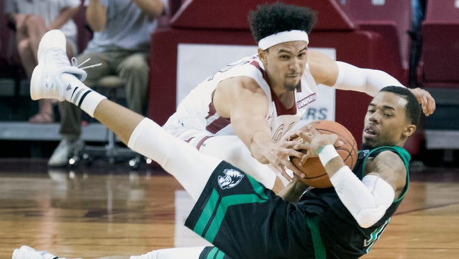 New Mexico State's Eli Chuha, top, and the Aggies host Seattle Saturday night at the Pan American Center.