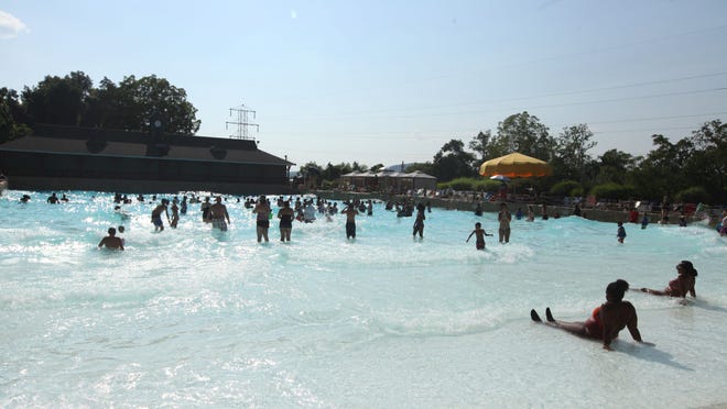 Guests relax in the wave pool at Mountain Creek Waterpark in Vernon Friday, August 24, 2018. Mountain Creek is one of several water parks and amusement parks set to reopen at 50% capacity July 2.