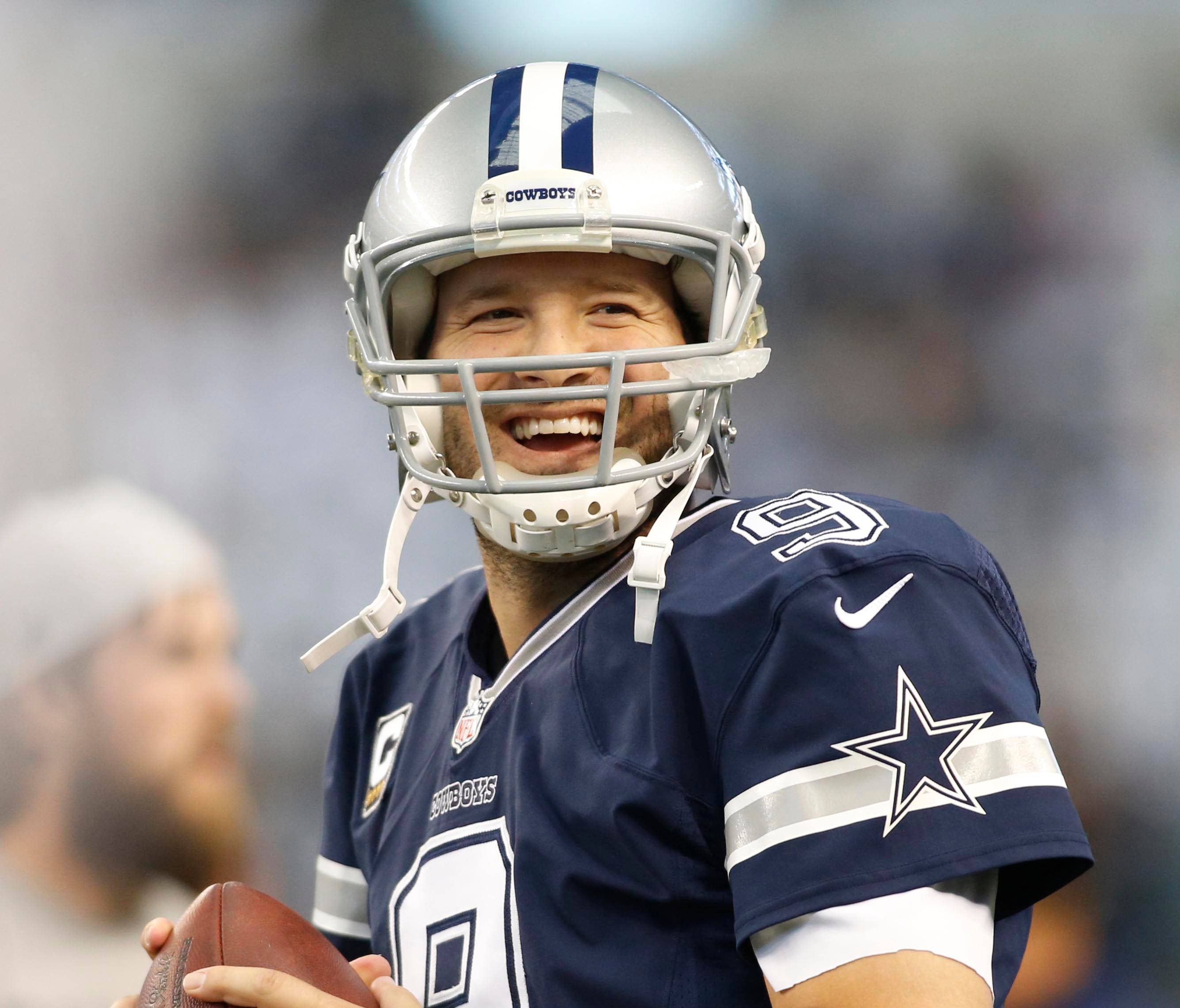 Dallas Cowboys quarterback Tony Romo (9) warms up before the game against the Philadelphia Eagles at AT&T Stadium.