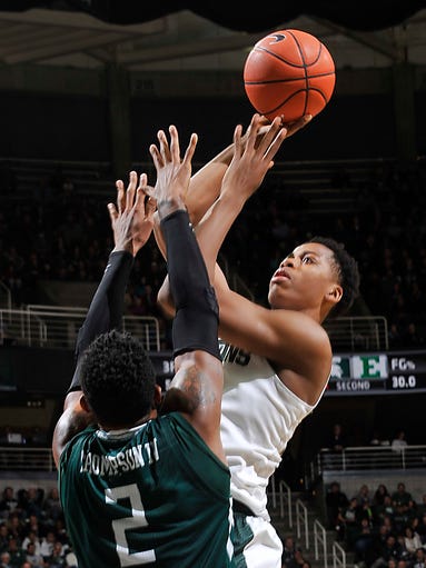 MSU's Deyonta Davis scores over the top of Eastern's