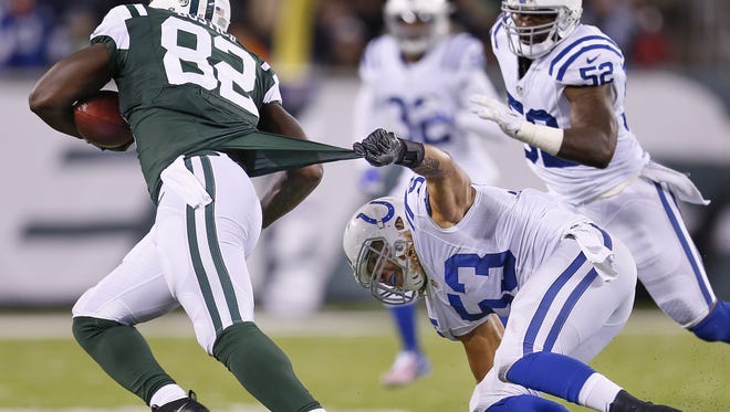 Colts inside linebacker Edwin Jackson tried to pull Jets tight end Brandon Bostick down by the jersey during their game Monday.