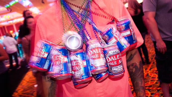 A reveler at Canfest 2014 works a beer can necklace. Canfest 2015 includes about 40 to 50 brewers offering more than 100 canned beers.
2014 Canfest at the Peppermill Resort Hotel presented by Joseph James Brewing Co., Saturday, August 23, 2014.