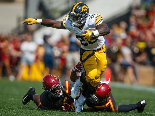 Iowa's James Butler escapes a tackle during the first