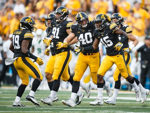 Iowa's Parker Hesse (40), left, congratulates Iowa's