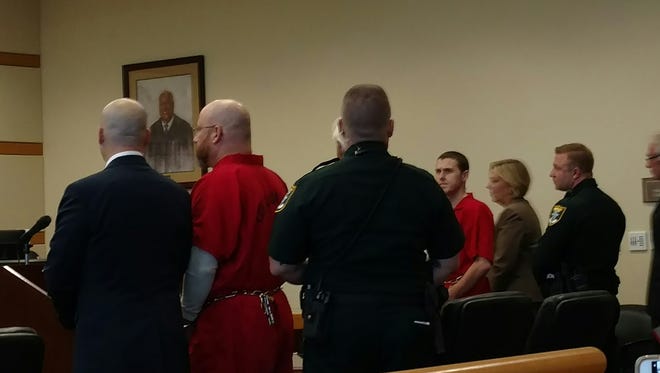 Lawyers and deputies surround Mark Sievers, left, and Jimmy Rodgers. They had a pre-trial hearing Friday in the 2015 murder of Sievers' wife, Teresa.