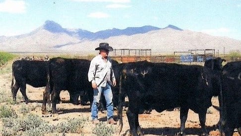 Robert Gobleck tends to the cattle on his ranch located in northern Luna County.