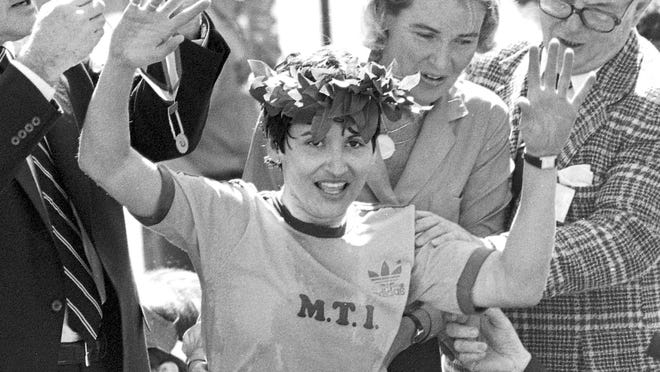In this April 21, 1980 file photo, Rosie Ruiz waves to the crowd after after being announced as winner of the women's division of the Boston Marathon in Boston. Her title was stripped eight days later when it was found that she had not run the entire course. Ruiz died July 8, 2019 in Florida. She was 66.